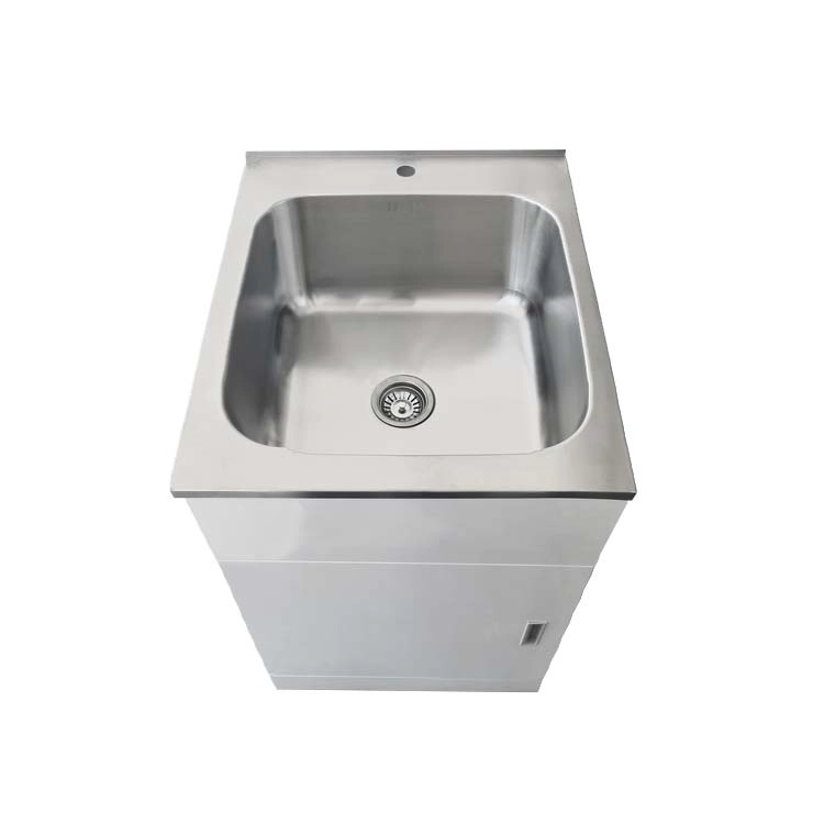Laundry sink with drain and cabinet