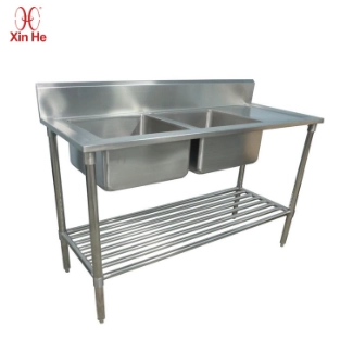 Two-compartment stainless steel sink designed for garden kitchens, cleanup stations, and food prep zones