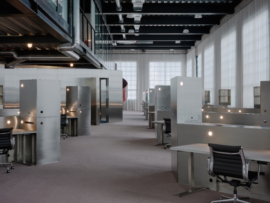 Custom stainless steel fabrication for modern office cubicles with integrated lighting and sleek metal storage units
