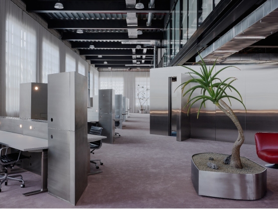 Architecture studio workspace featuring custom stainless steel fabrication for metal partitions and bespoke planters