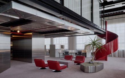 Custom stainless steel fabrication for architectural wall panels and planters in a modern design studio lounge